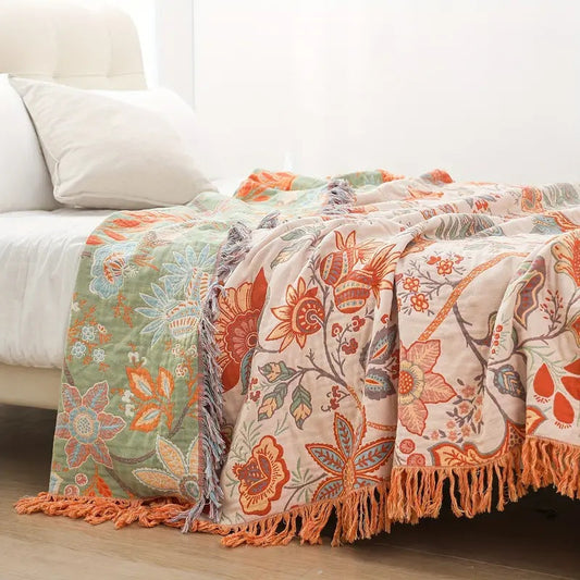 Florale Boho-Wohndecke aus Baumwolle mit kunstvollen Fransen
