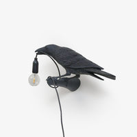 Wandlampe in Vogelform